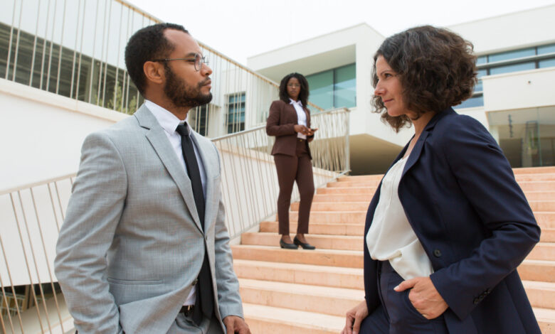 Business partners or colleagues staring at each other